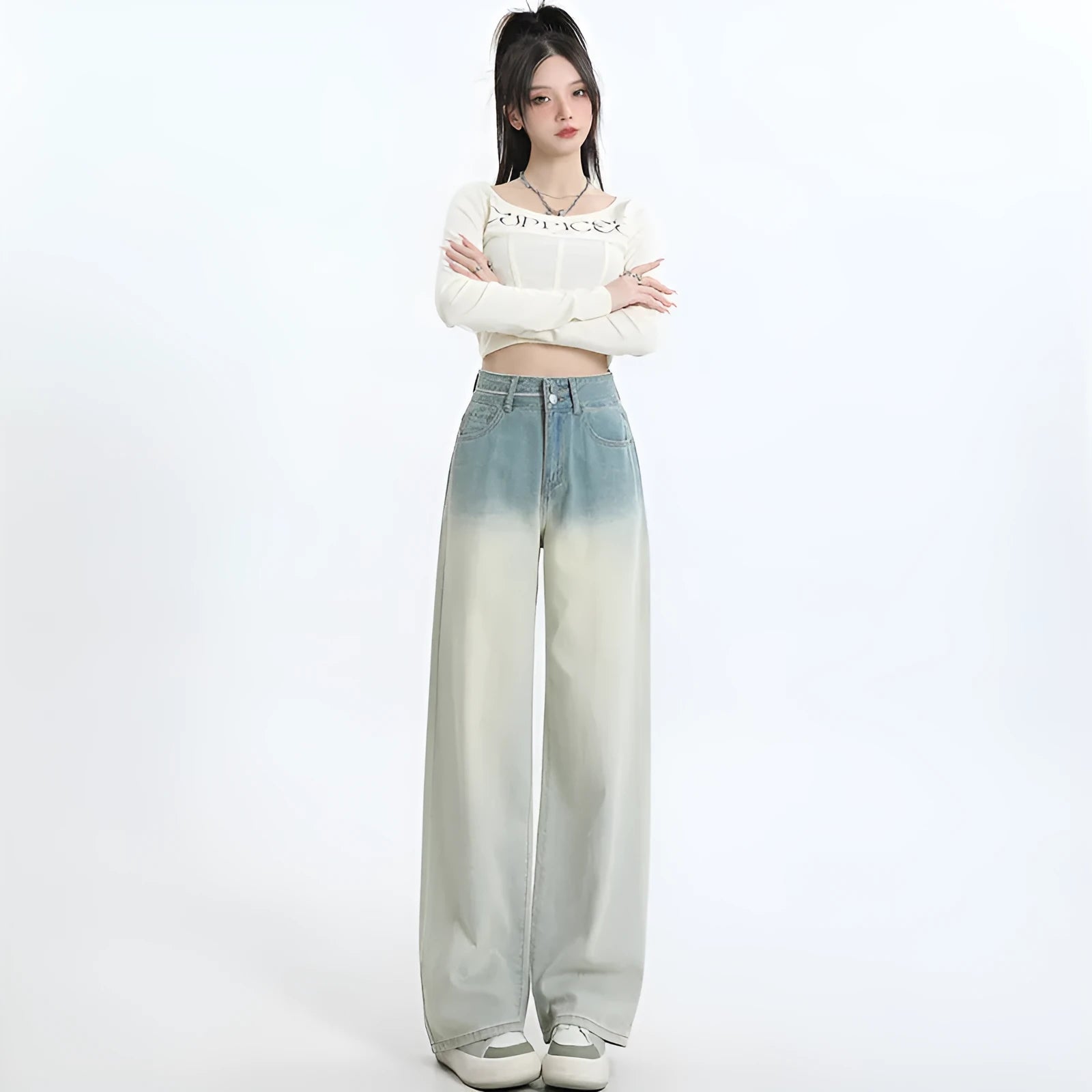 Women's gradient blue straight-leg denim trousers on a hanger.
