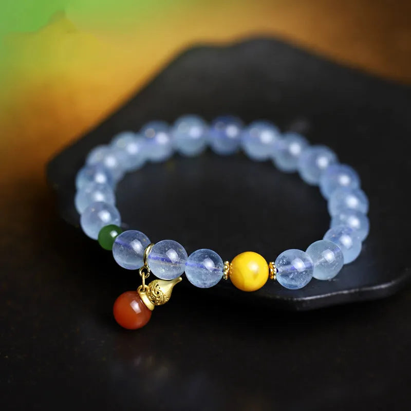 Women's geometric bracelet with blue 8mm aquamarine beads and ethnic retro design.