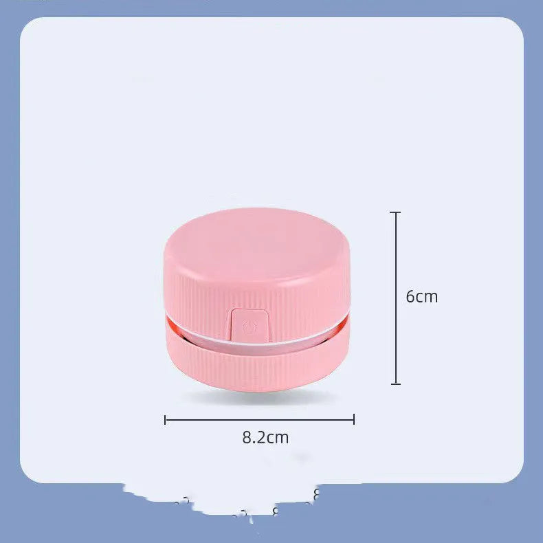 Blue and pink portable mini desktop vacuum cleaner for pencil shavings and small debris