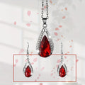 Black and red alloy necklace and earrings set with matching teardrop pendant and droplet earrings.