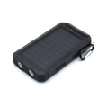 Black solar power bank with LED flashlight showing dimensions and charging ports