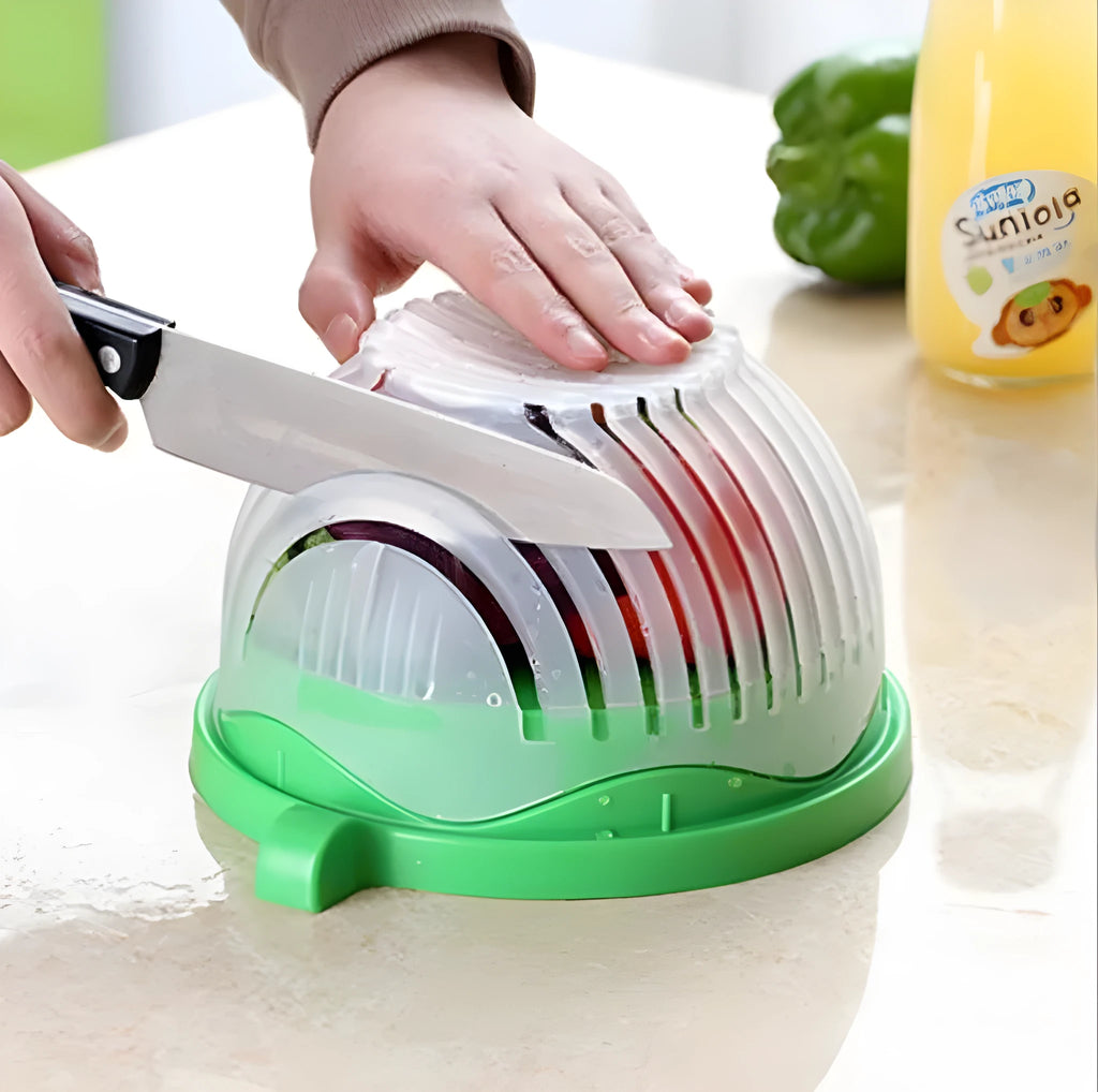 Blue salad cutter bowl with chopping lid and serving plate base on a kitchen counter