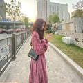 Red knitted women's dress with elastic high waist and three-quarter princess sleeves