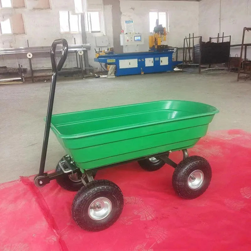 Green four-wheel steel and plastic dump truck with large load bed.