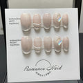 Women's hand-painted blush armour artificial nail set with short length design showing four size options