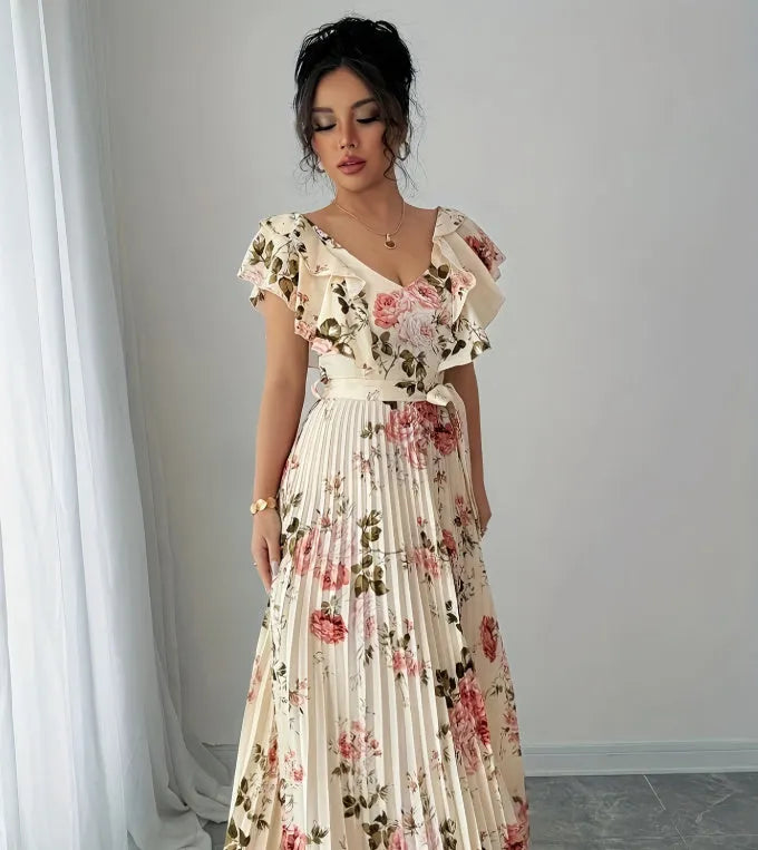 Apricot-coloured women's V-neck floral print dress with ruffled short sleeves and a long, pleated oversized swing skirt.