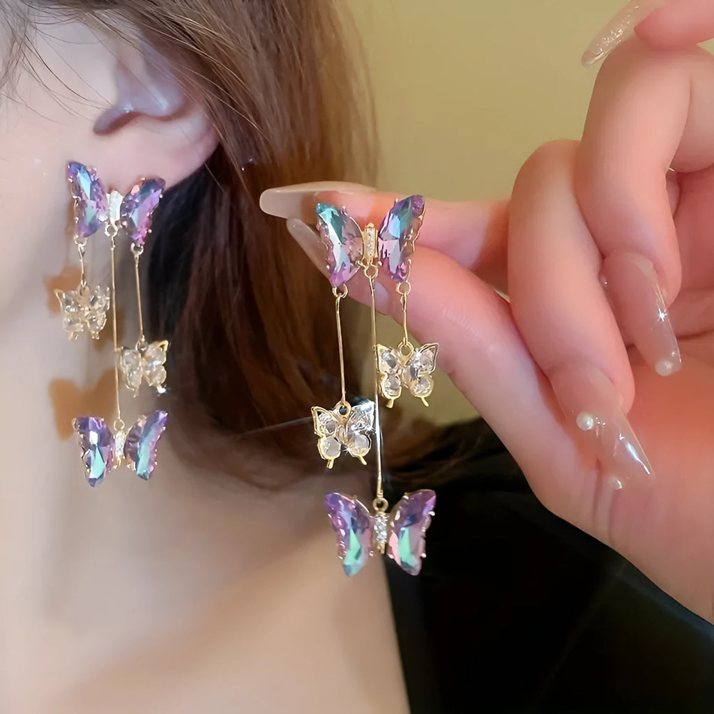 Silver Needle Crystal Flowers Butterfly Tassel Earrings in blue purple with a 5.5cm drop on a hypoallergenic alloy post.