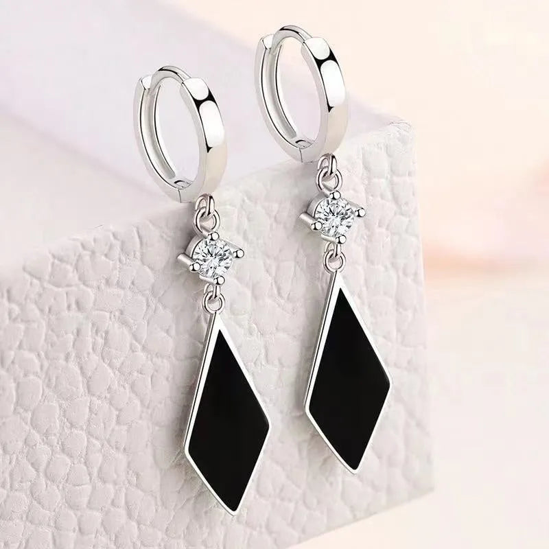 Geometric diamond silver ear clip earrings with angular design on zinc alloy base