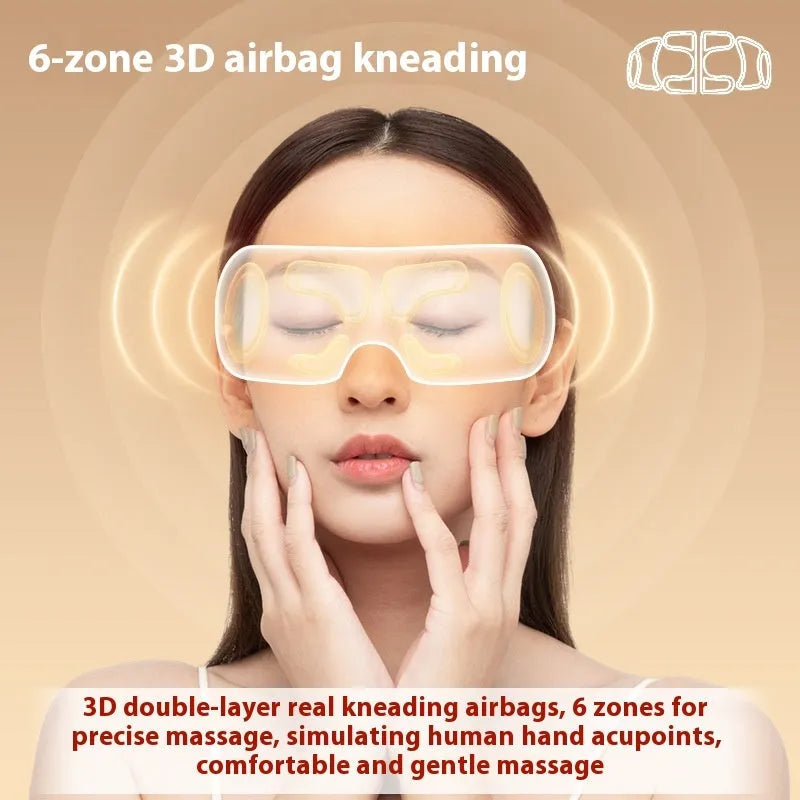 White rechargeable airbag eye massager with heat compression on a plain background