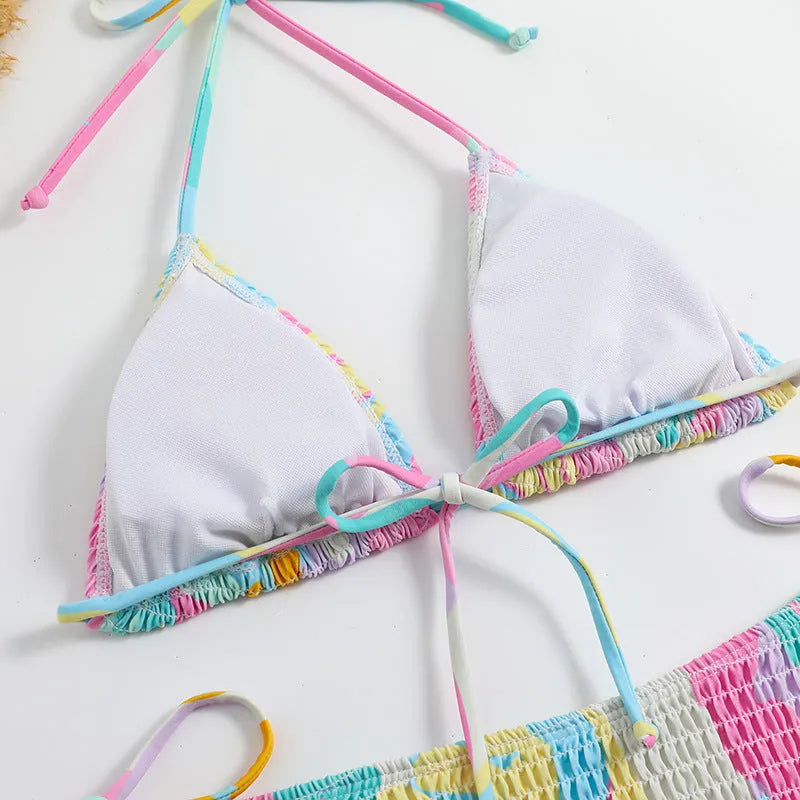 Women's triangle bag bikini swimsuit with printed floral gradient pattern and smocking detail