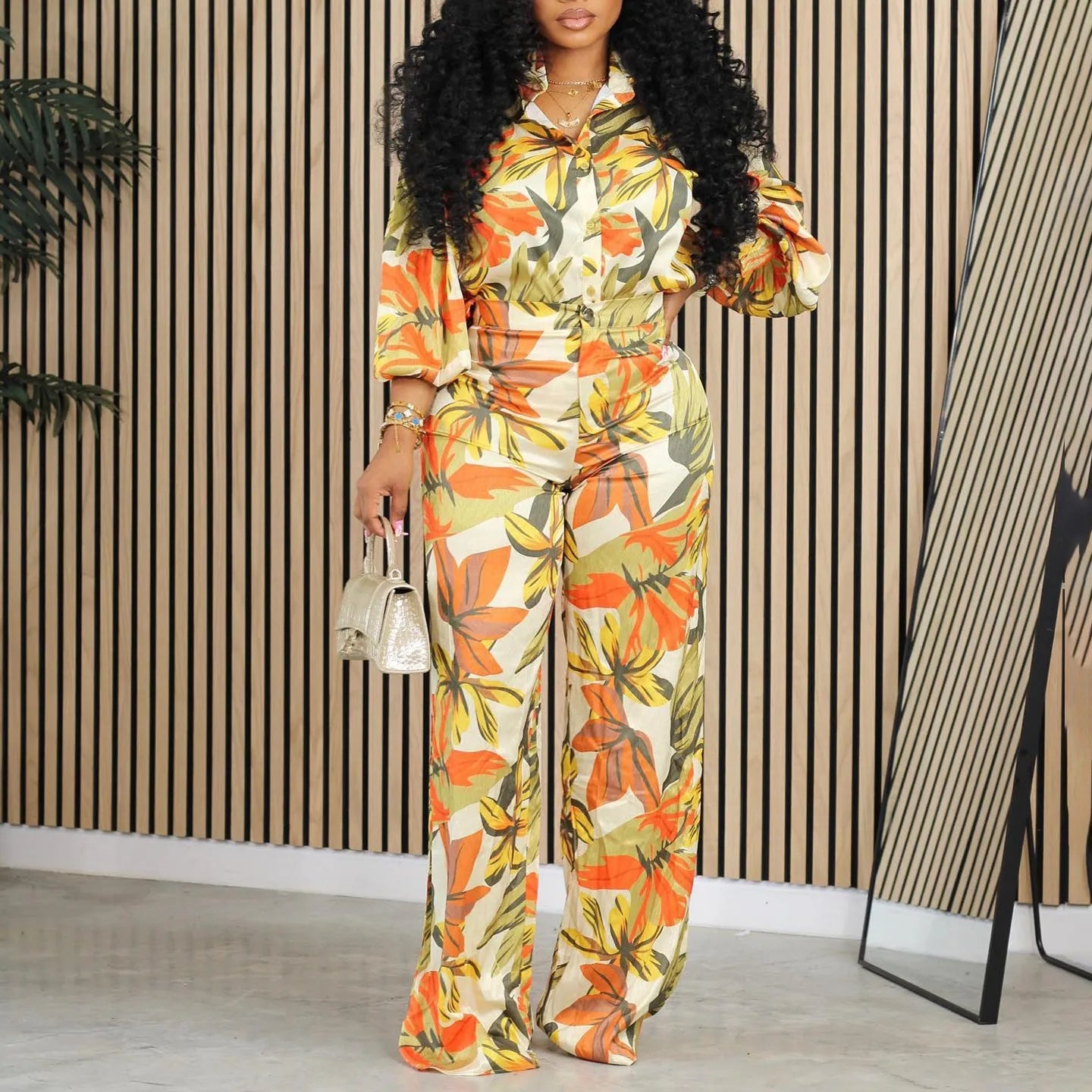 Red printed polyester wide leg pants suit with matching long sleeve shirt.