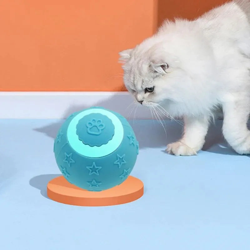 Blue smart ball cat toy with rechargeable feature and rolling motion on a floor
