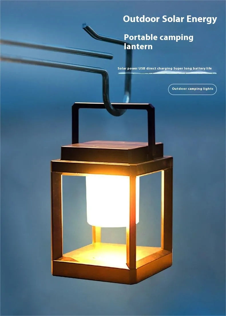 Outdoor USB handheld multifunctional charging ambient light lantern with black cover and white shell