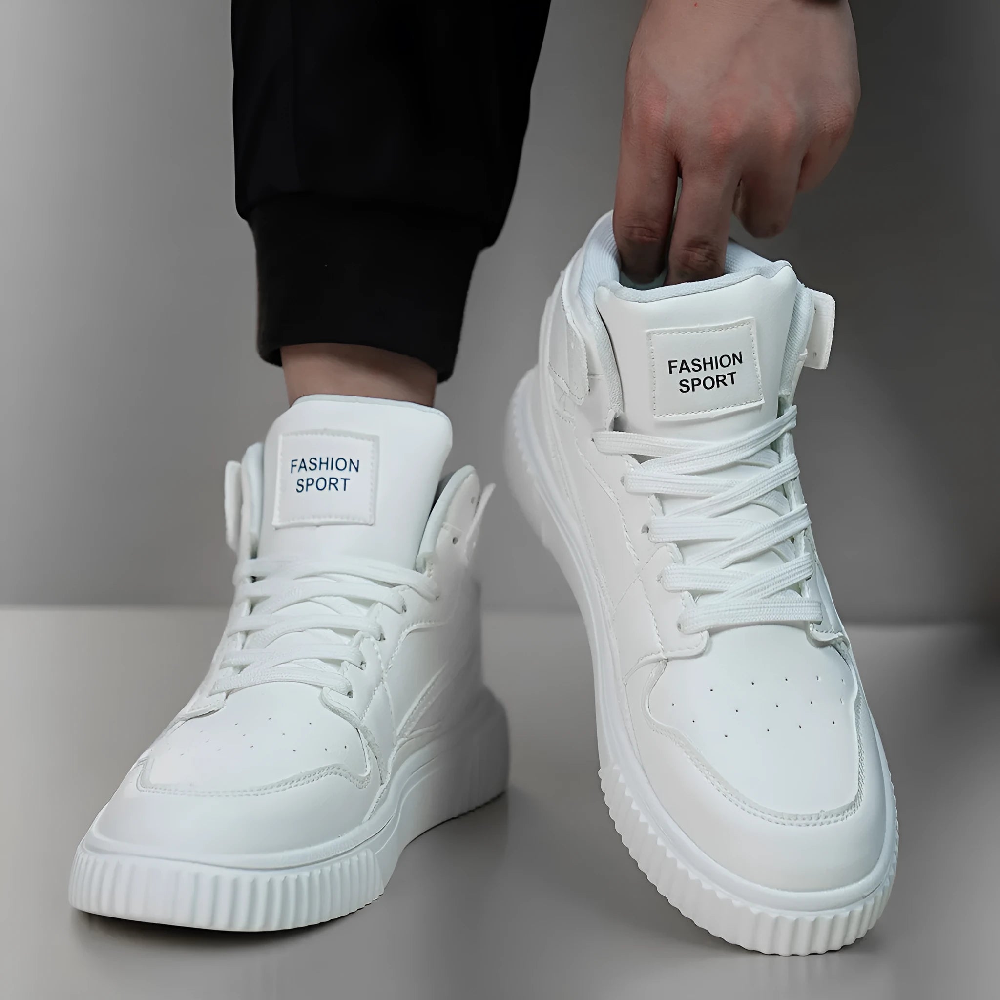 Men's white casual shoes with round toe and microfiber upper on a plain background.