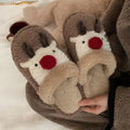 Women's green Christmas deer plush slippers with non-slip PVC soles.
