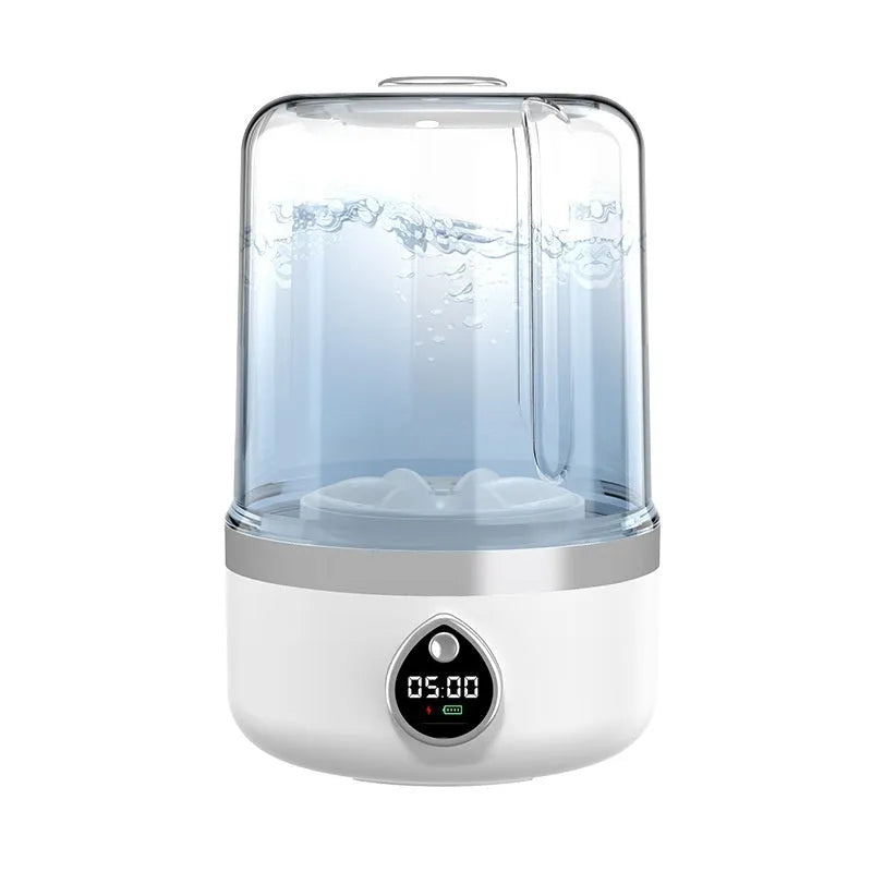 White portable mini washing machine with USB cable on a countertop.