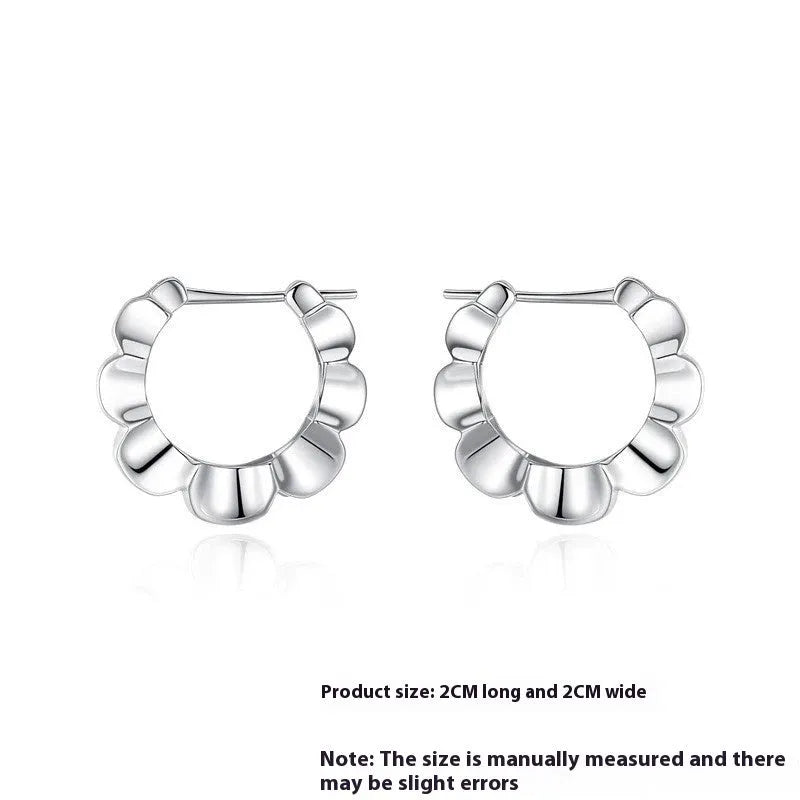 A pair of sterling silver retro geometric earrings with round elements and an electroplated finish.
