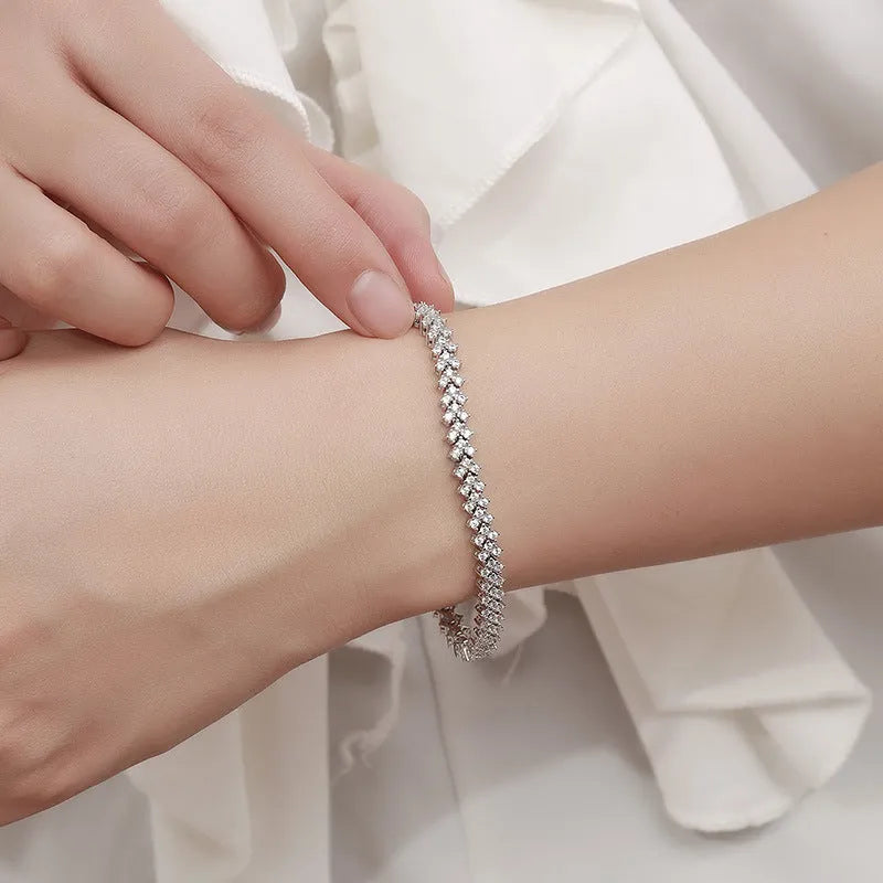 Silver plaid bracelet for women with moissanite stone on light background