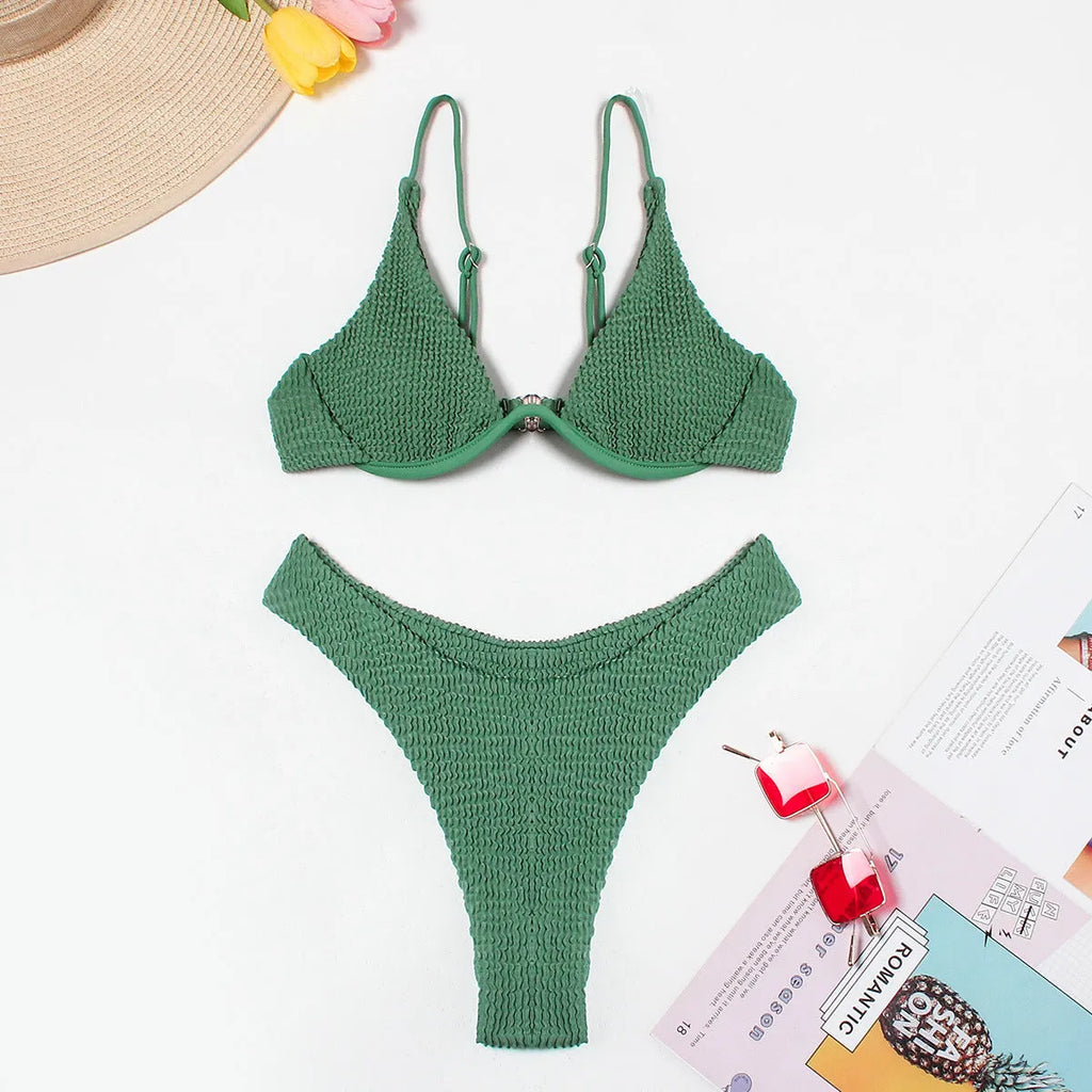 Green women's bikini swimsuit with ruffle detailing and briefs style