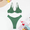 Green women's bikini swimsuit with ruffle detailing and briefs style