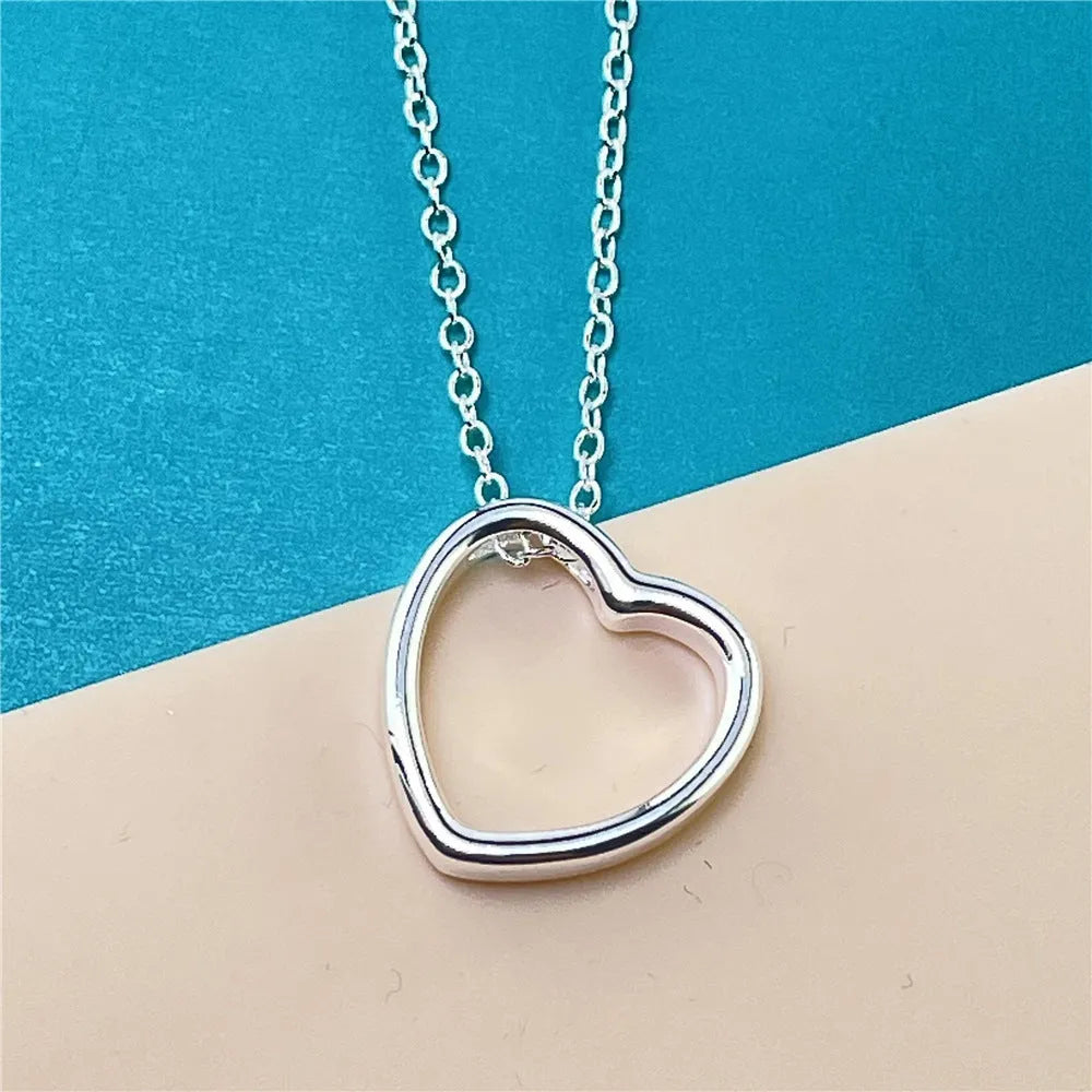 Silver heart necklace for women with 45.5cm chain and 2.6 x 2.8cm heart pendant in thick silver plating over copper.