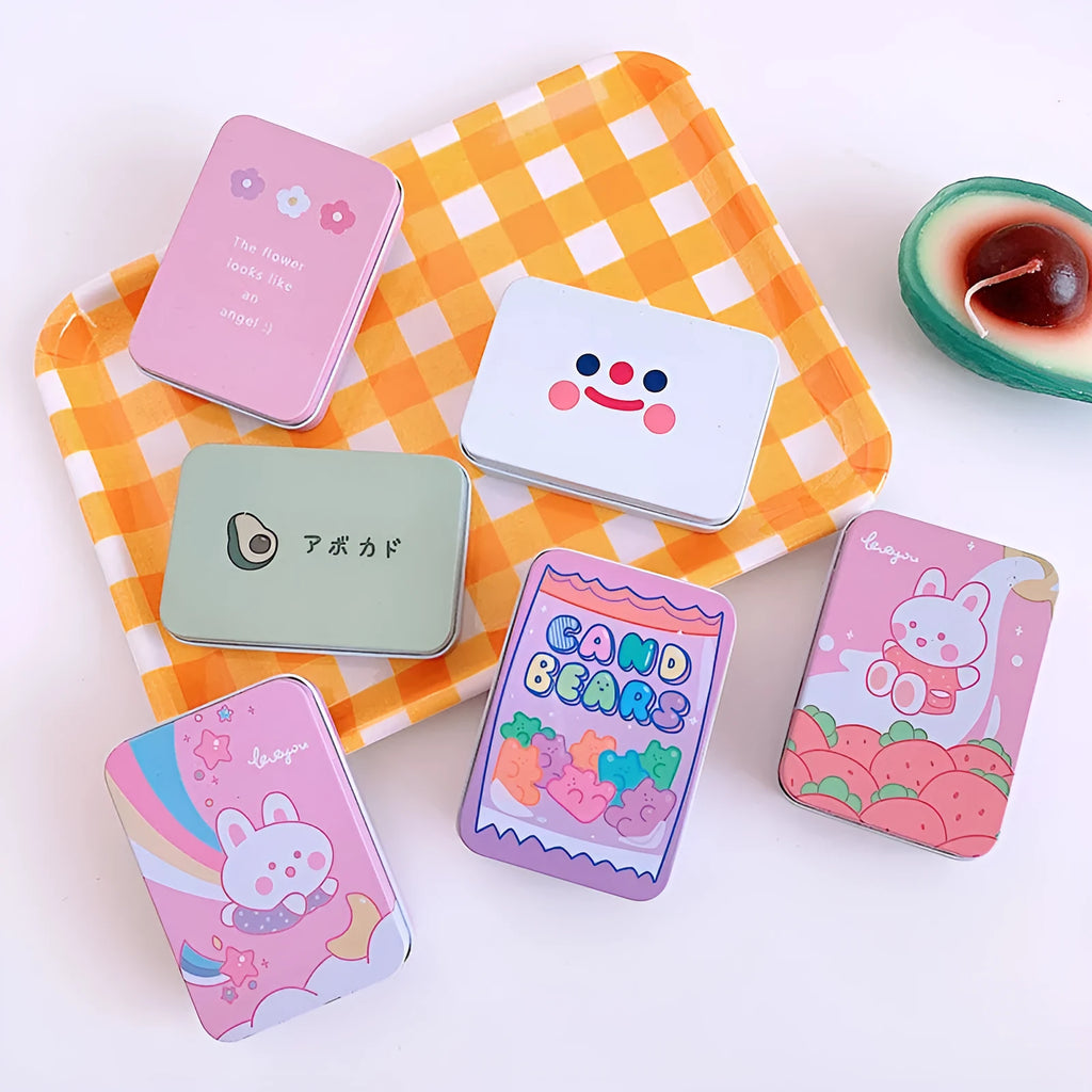 Small iron craft storage tin with colourful printed design measuring 9.5cm long