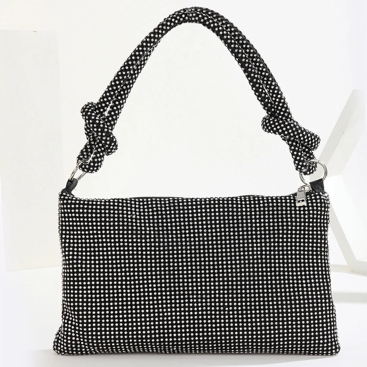 Rhinestone evening bag with full diamond finish, approximately 26x16cm, 13cm handle, polyester lining.