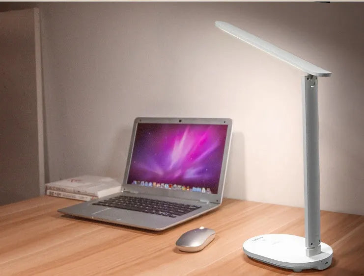 White LED charging table lamp with touch switch and ABS shade on a desk