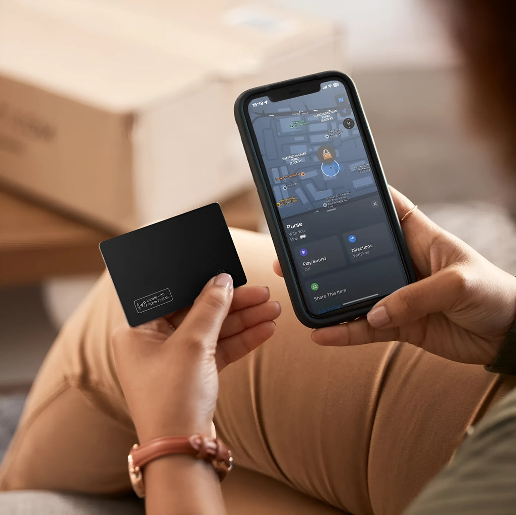 Black ultra-thin anti-loss card for Apple devices, shown next to a credit card for size comparison.