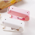 Mini bag sealer in white or pink, 9cm x 4cm x 6cm, with magnetic or non-magnetic option