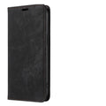 Magnetic flip phone case for iPhone in black, showing closed front cover with leather finish.