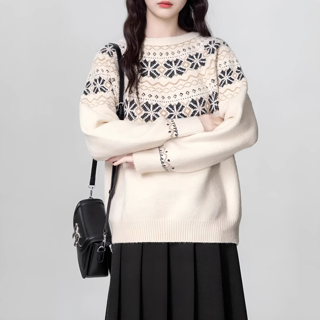 Women's loose-fit Milky White Fair Isle knitted pullover sweater on a hanger, showing geometric pattern and thick lambswool blend fabric.