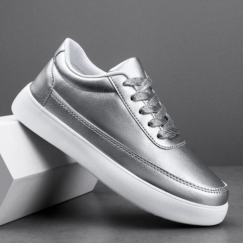 Women's white leather casual flat lace-up shoes on a neutral background, showing front and side views.