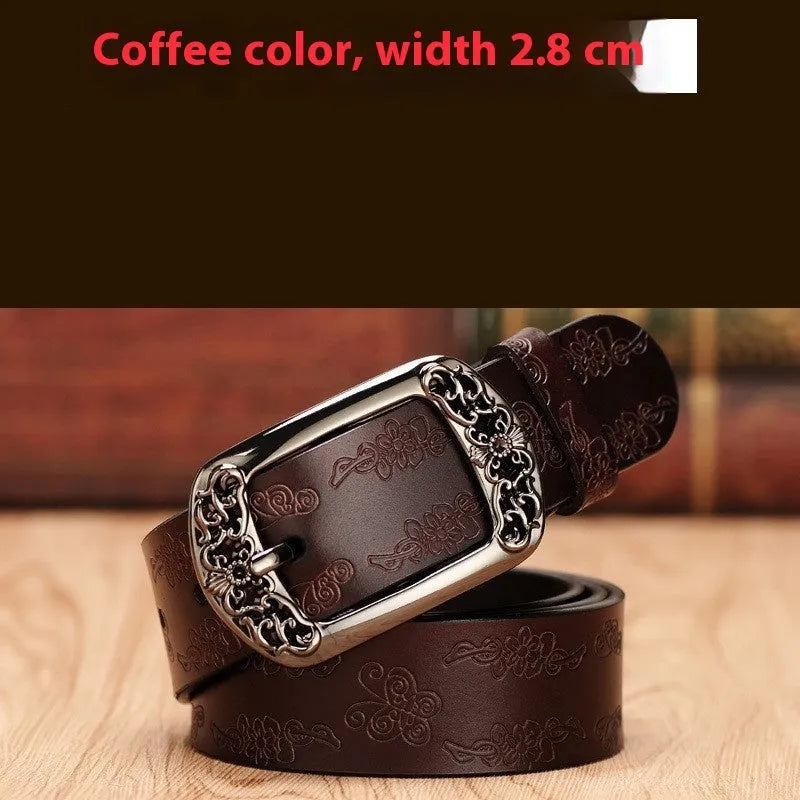 Thin black PU leather women's belt with an alloy buckle on a pair of jeans