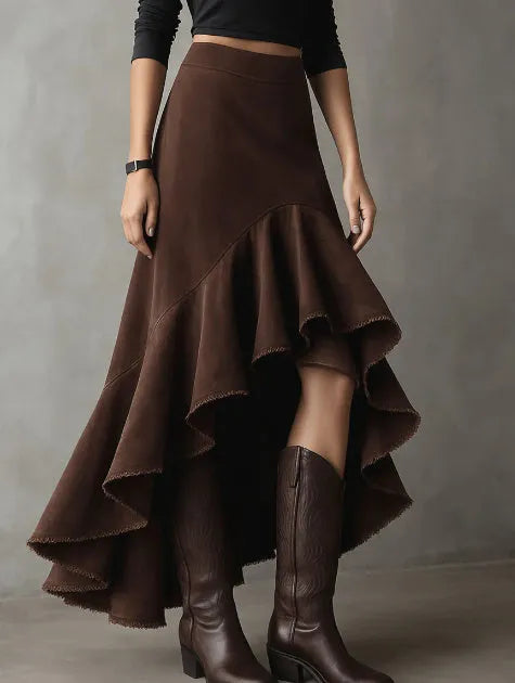 Brown women's high-low maxi skirt with a ruffle hem and textured eco suede finish.