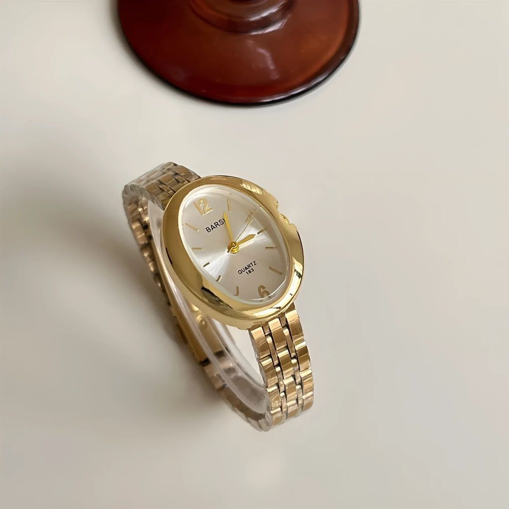 Oval alloy ladies watch with gold strap and choice of white gold or red dial face stainless steel back