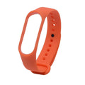 Multi-coloured silicone replacement straps for Xiaomi Mi Band 3 fitness tracker on a white background.