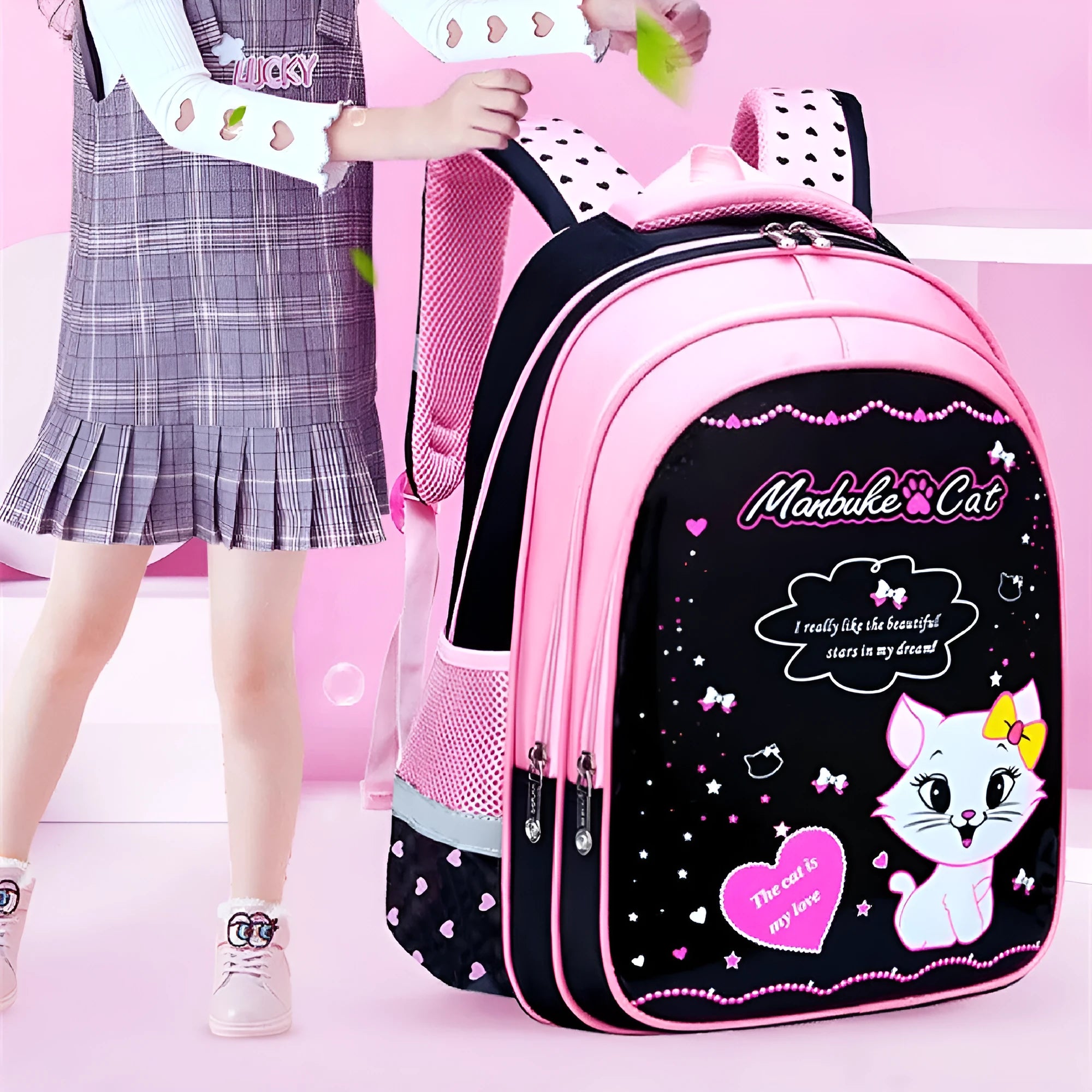 Blue kids school backpack with cute cat print showing front zipper compartment and shoulder straps