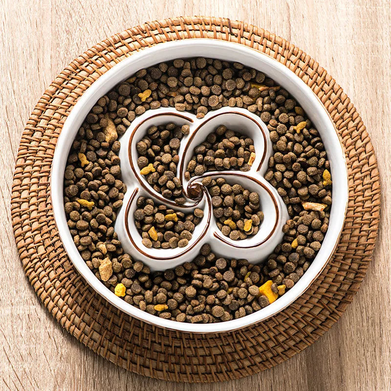 Blue ceramic slow feeder dog bowl with maze pattern and non-slip rubber base for large dogs.