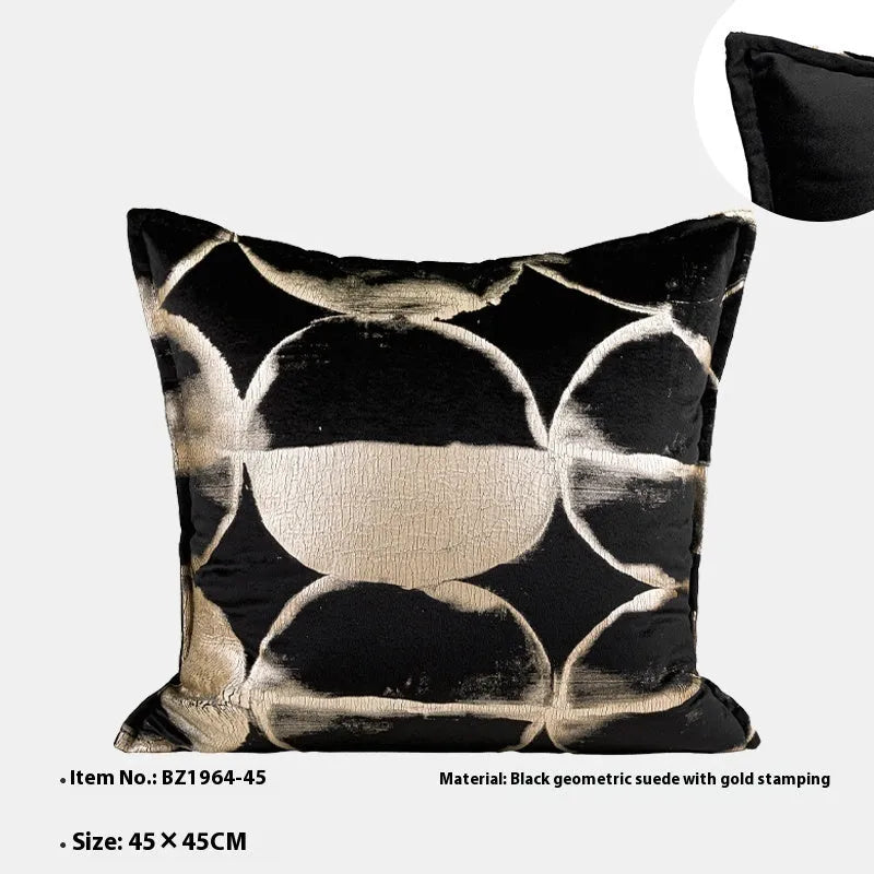 Black and gold abstract full moon pattern flannel cushion on a grey sofa