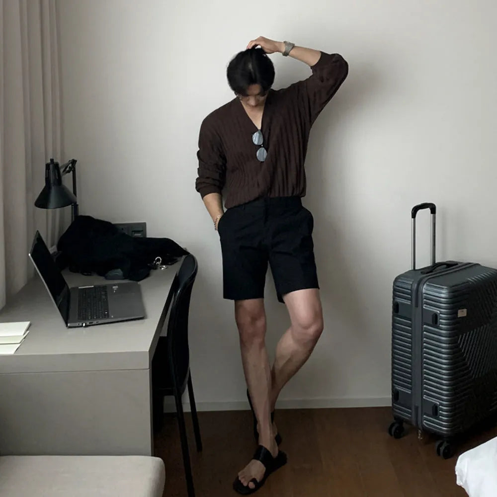 Men's straight leg casual shorts in solid colour on a hanger