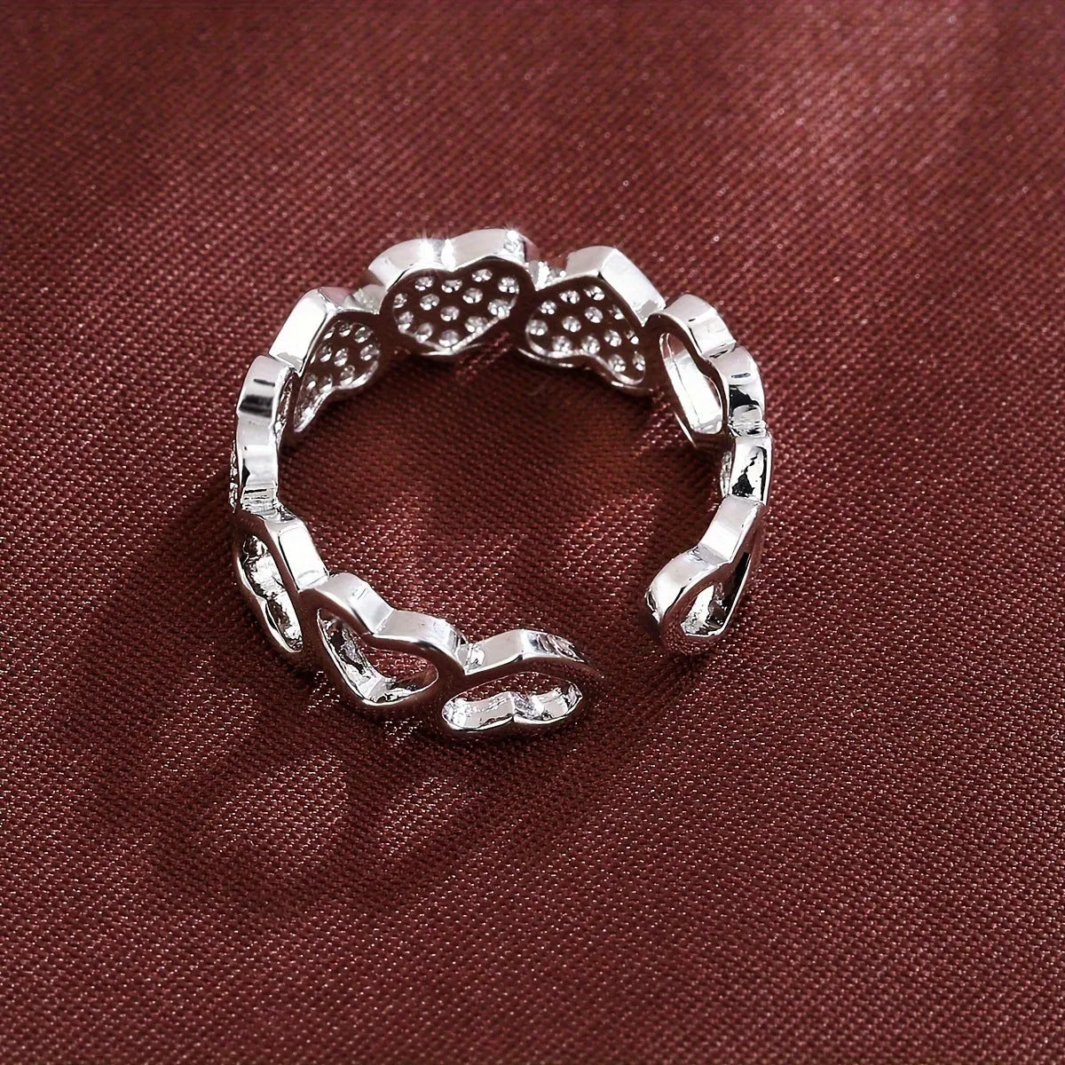 Geometric gold couples ring with heart engraving on an adjustable open band