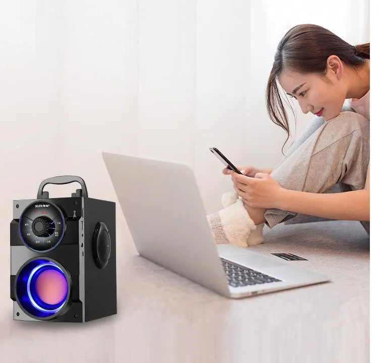 Black portable mini home audio system with subwoofer, USB cable, and 1.2m audio cable.