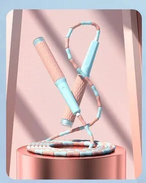 Children's skipping rope with soft blue bead handles and a non-knotted beaded cord.