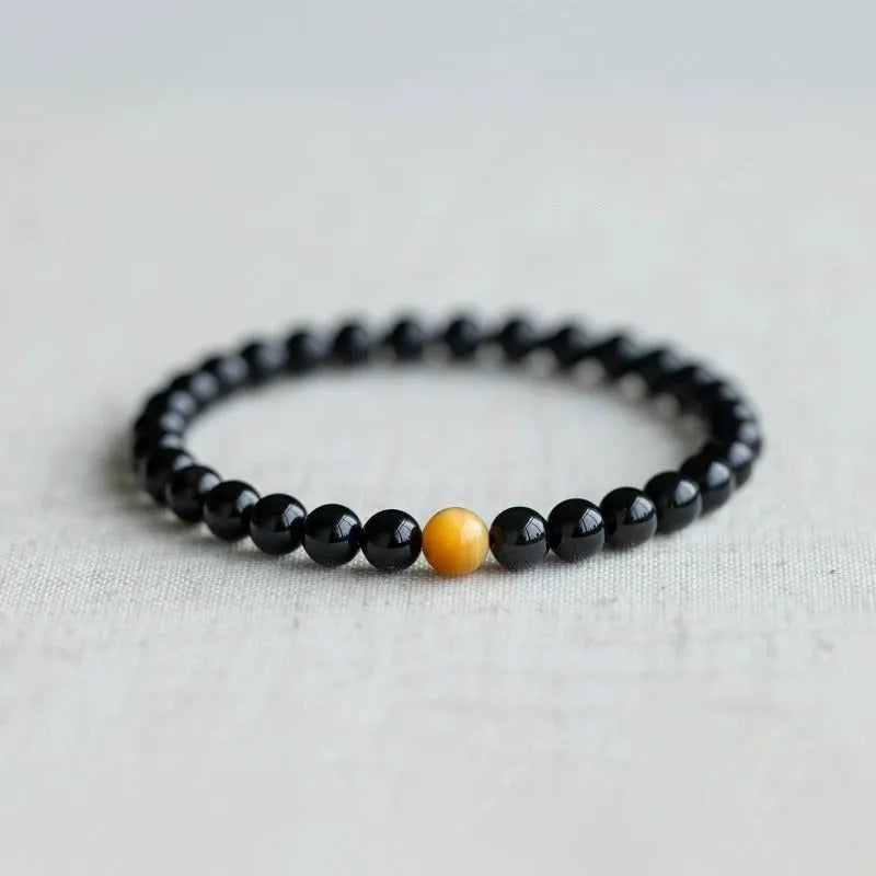 Black obsidian stone bracelet with geometric beads in Korean unisex style.