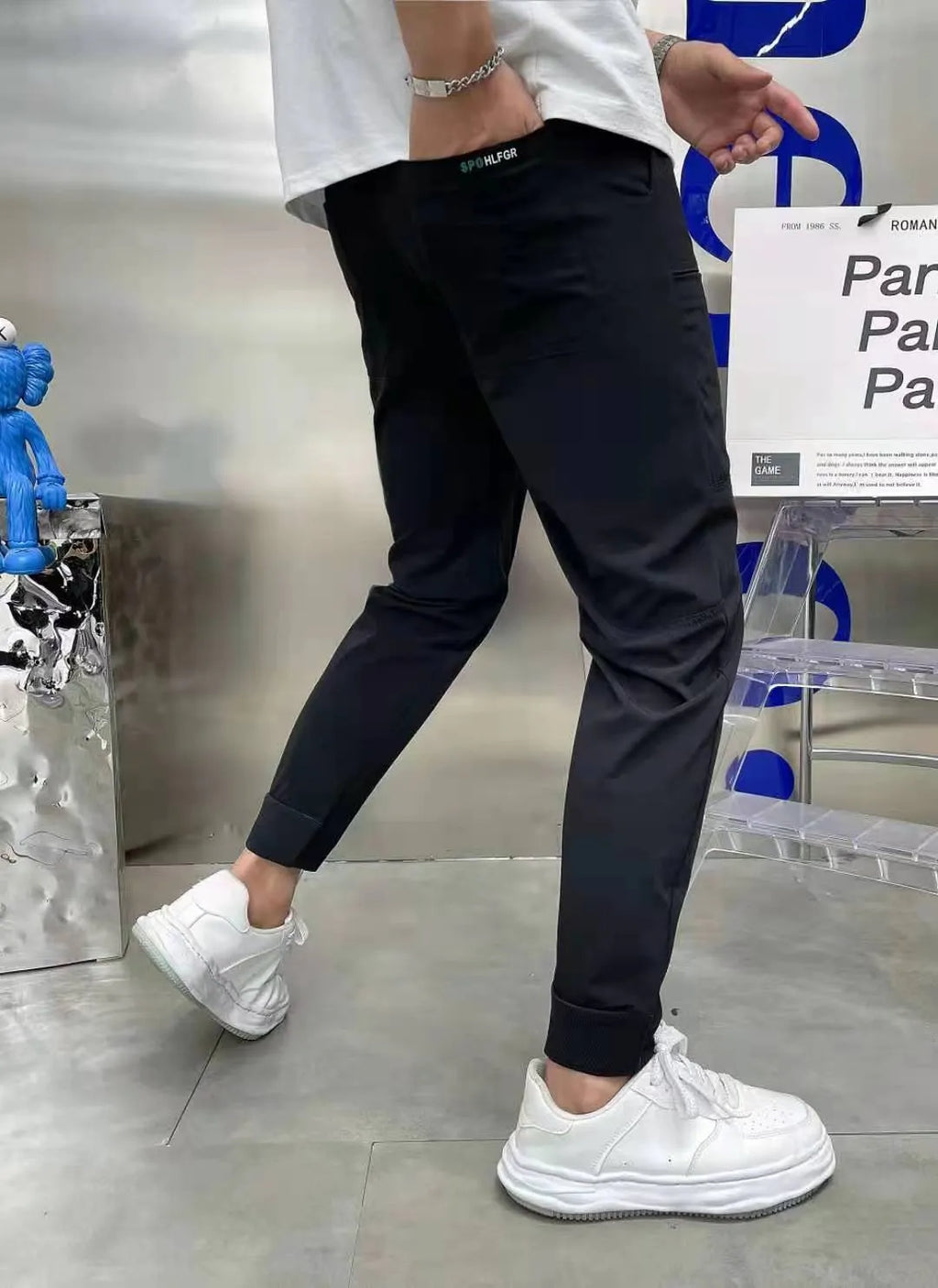 Men's ice silk stitching six-pocket embroidery high elastic casual pants in black, size 29-38