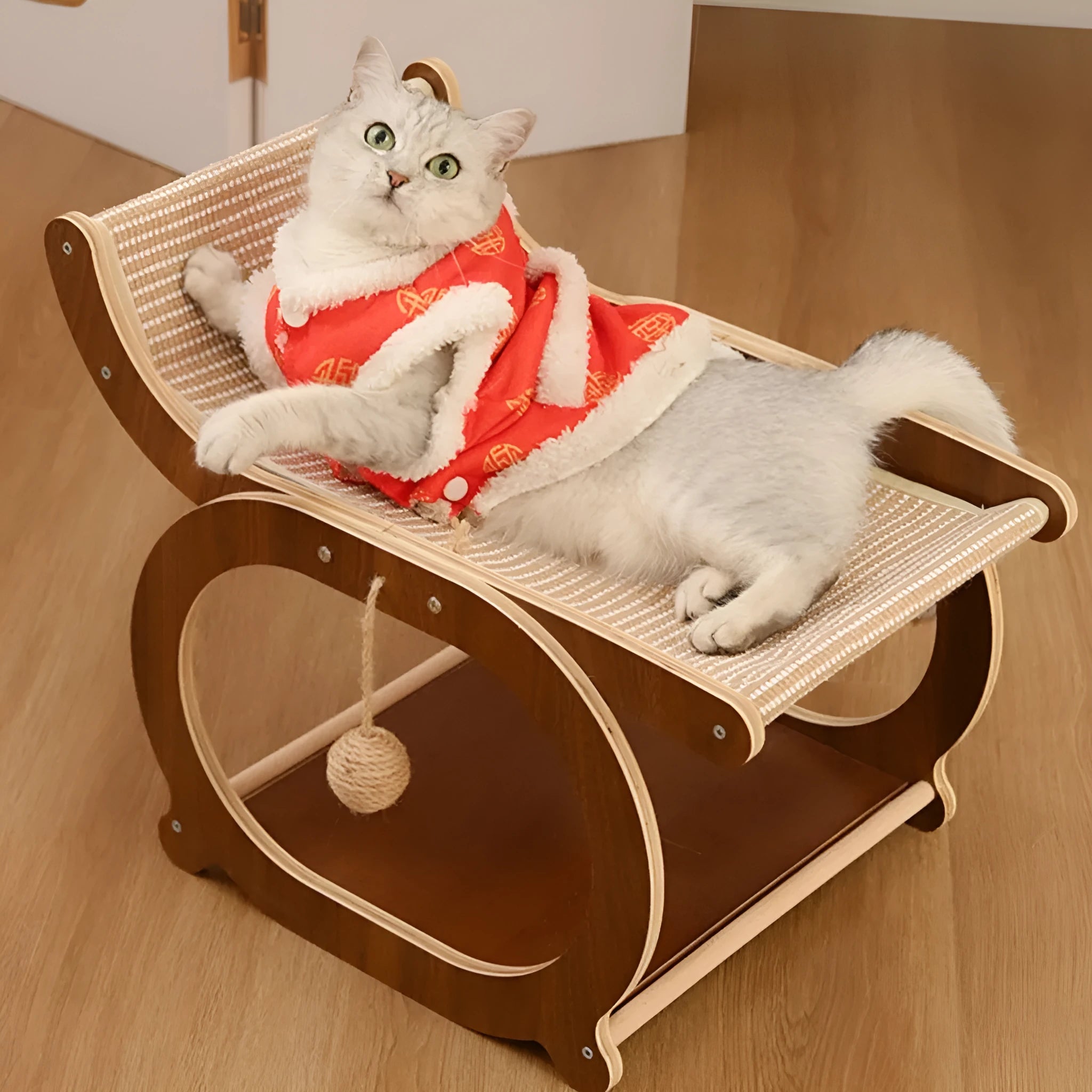 Solid wood frame cat bed with a light-coloured sisal scratching and lounging mat, shown on a wooden floor.