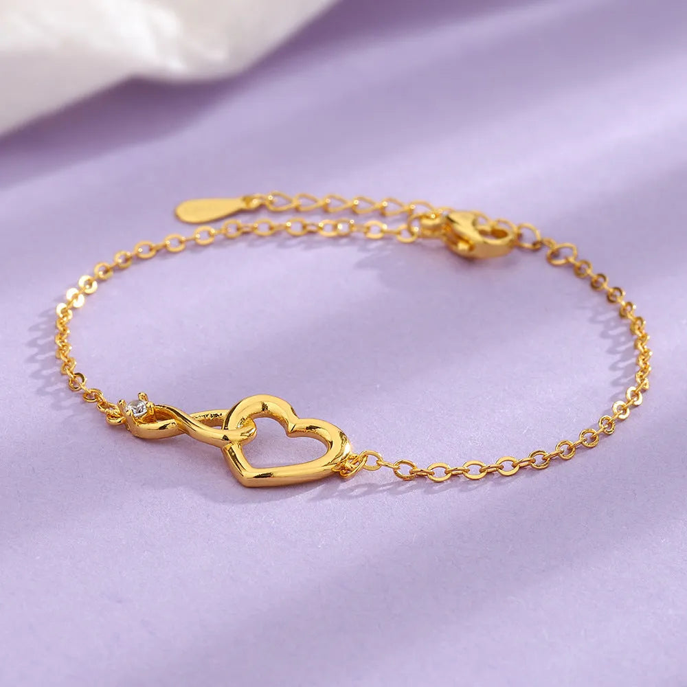 Heart-shape copper bracelet with clear 3A zirconia stone on adjustable chain in platinum finish