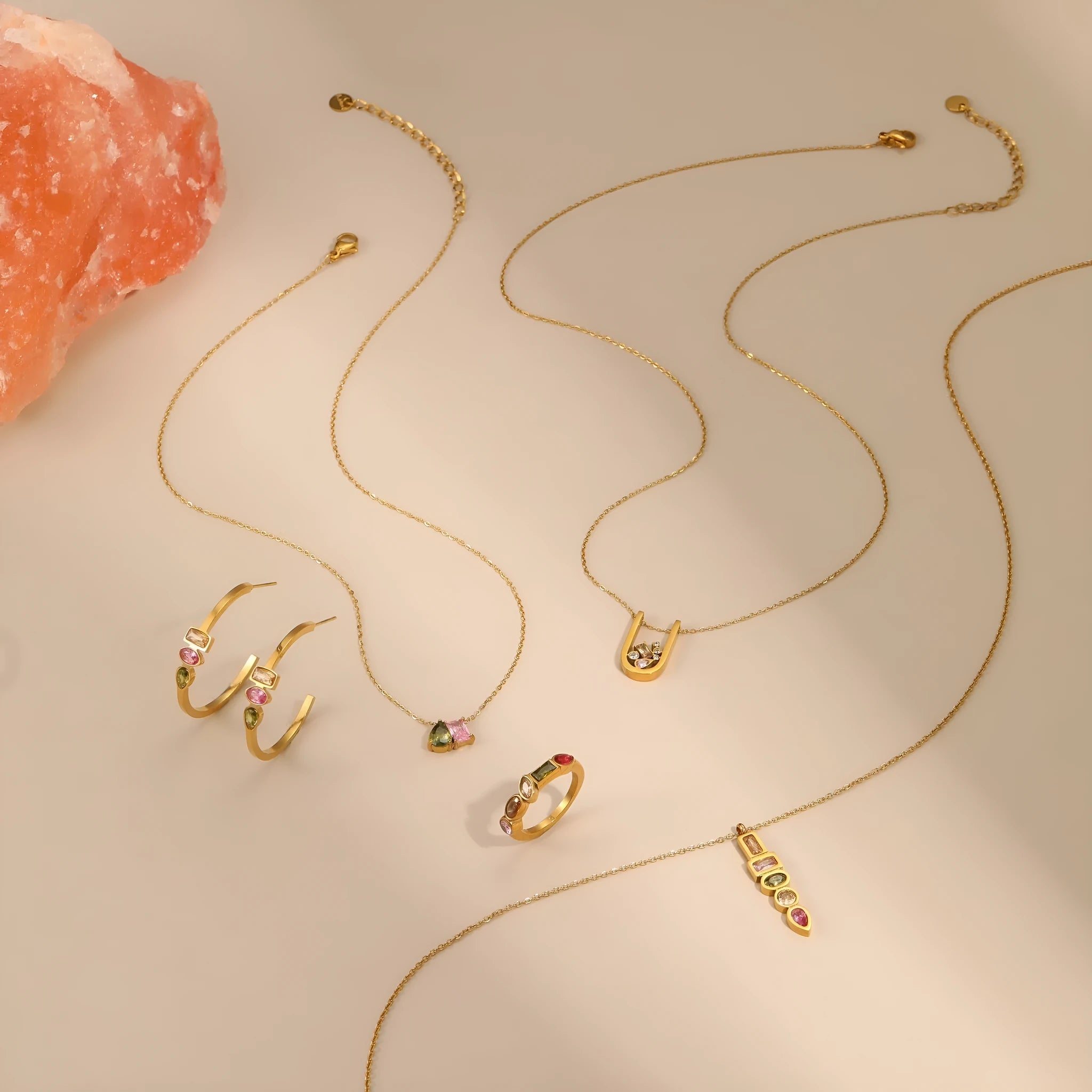 Geometric colour zircon jewellery set with gold-plated necklace, ring, and earrings on stainless steel chain.