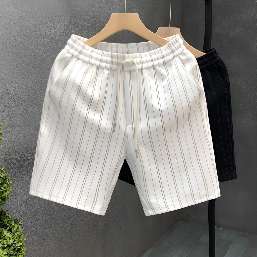 Men's black and white striped fleece-lined casual shorts with an elasticated waistband.
